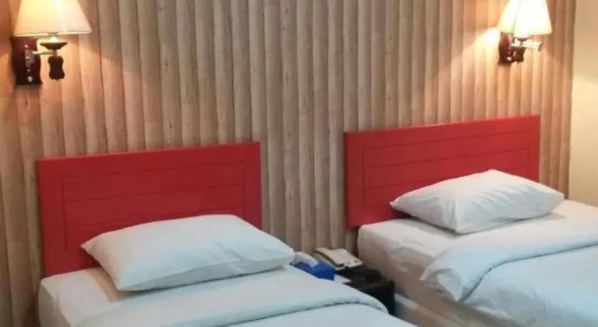 Bed in Queen City Hotel