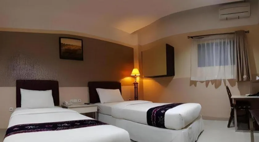 Bed in Queen City Hotel