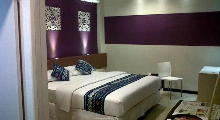 Bed in Queen City Hotel