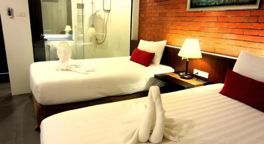 Bed in De Aerng Boutique Hotel