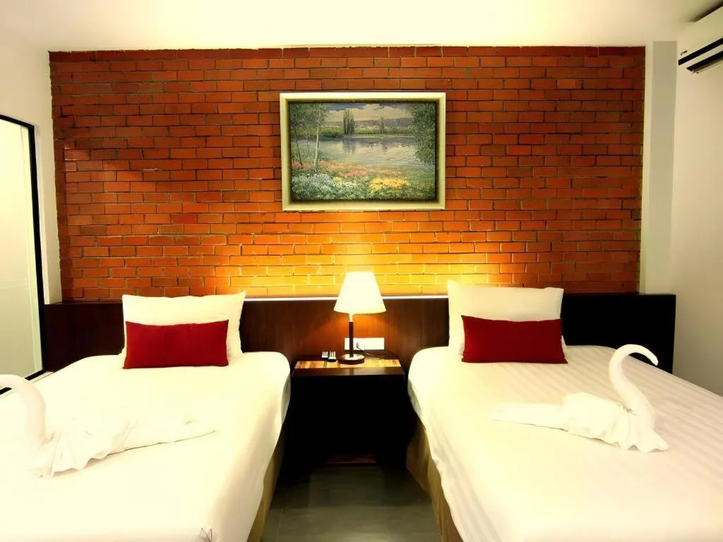 Bed in De Aerng Boutique Hotel