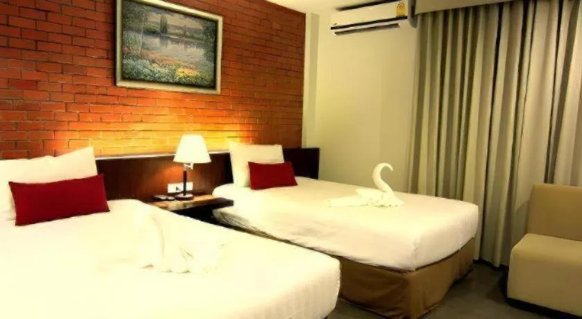 Bed in De Aerng Boutique Hotel