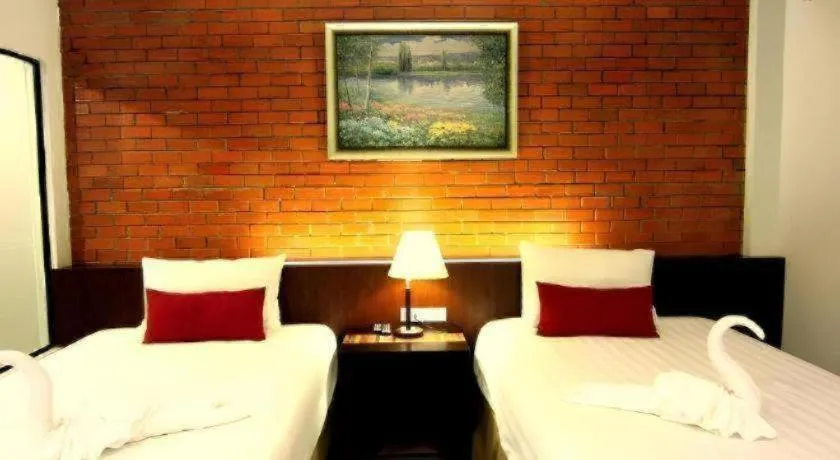 Bed in De Aerng Boutique Hotel