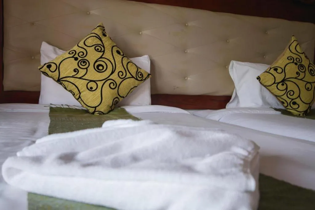 Bed in The View Pavilion Hotel