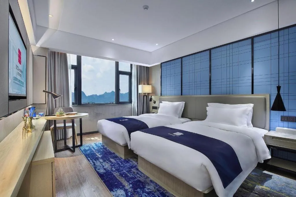 Bed in Echarm Hotel Guilin North High Speed Railway Station