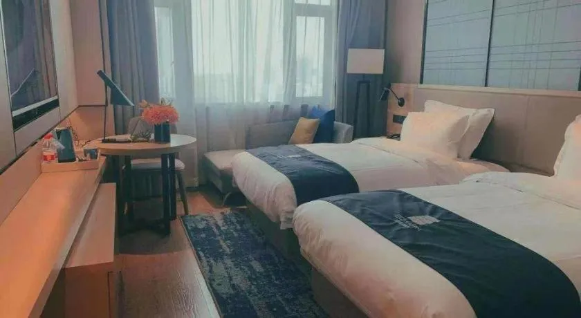 Bed in Echarm Hotel Guilin North High Speed Railway Station