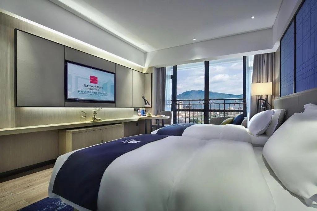 Bed in Echarm Hotel Guilin North High Speed Railway Station