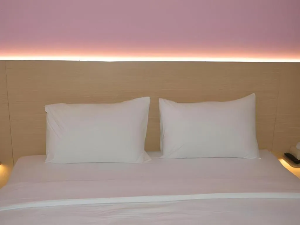 Bed in I&M Hotel Billiard