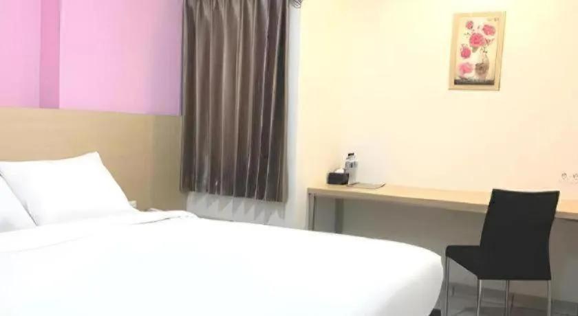 Bed in I&M Hotel Billiard