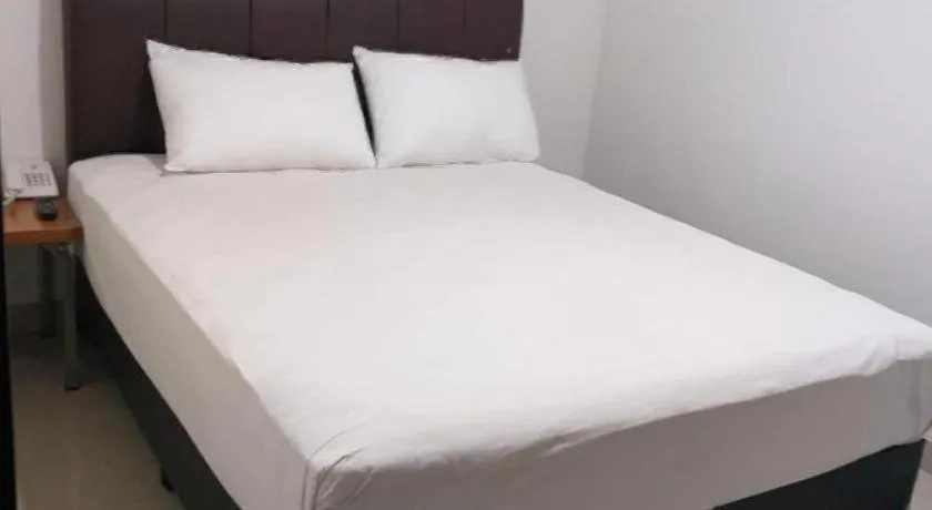 Bed in I&M Hotel Billiard