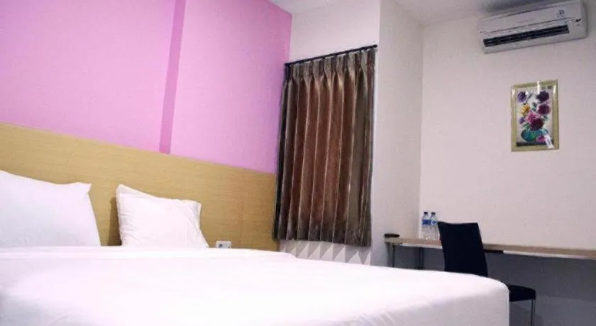 Bed in I&M Hotel Billiard