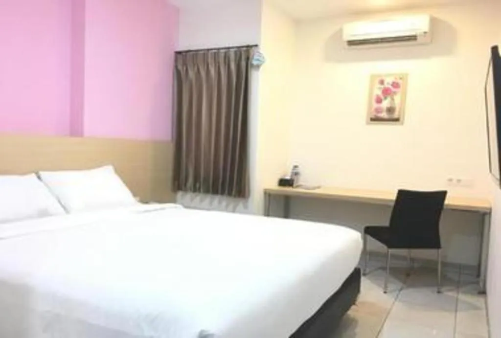 Bed in I&M Hotel Billiard