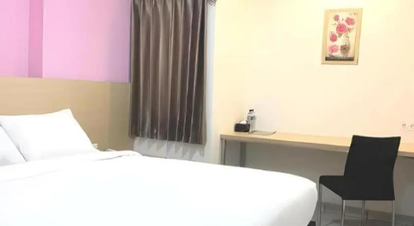 Bed in I&M Hotel Billiard