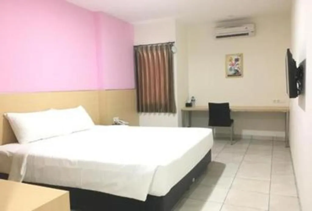 Bed in I&M Hotel Billiard