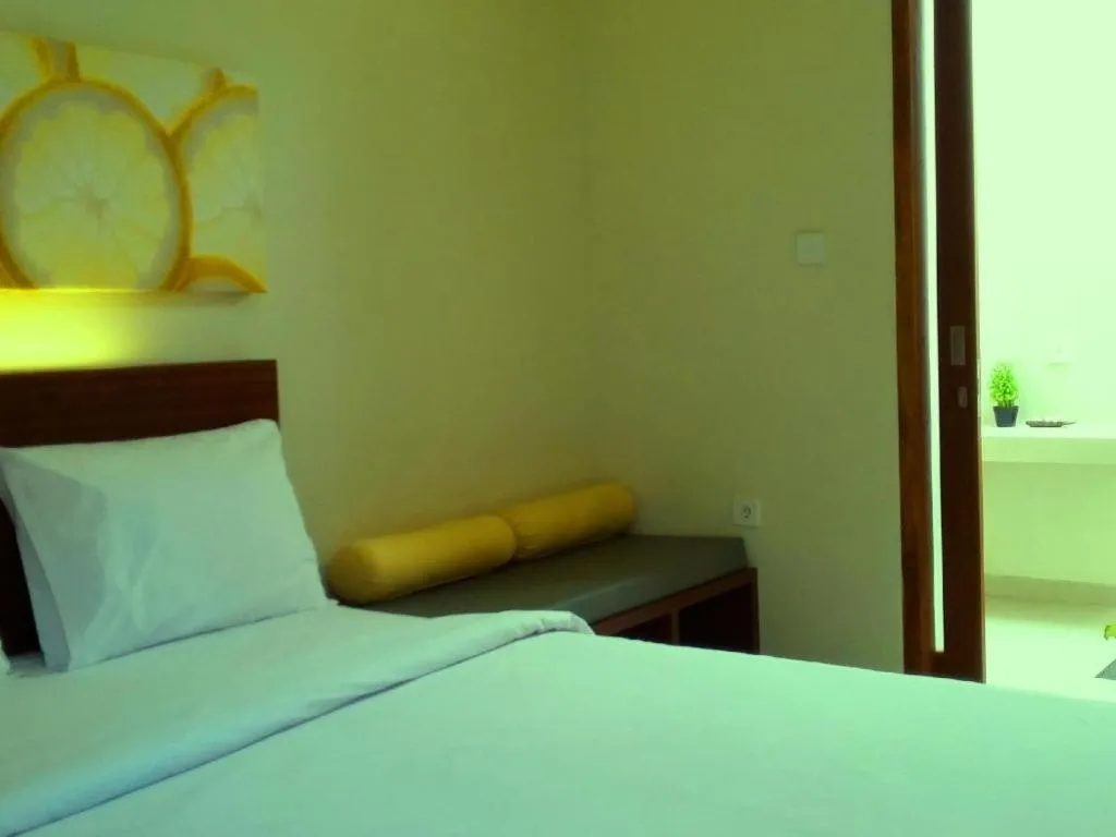 Bed in De Lemon Gatsu Hotel