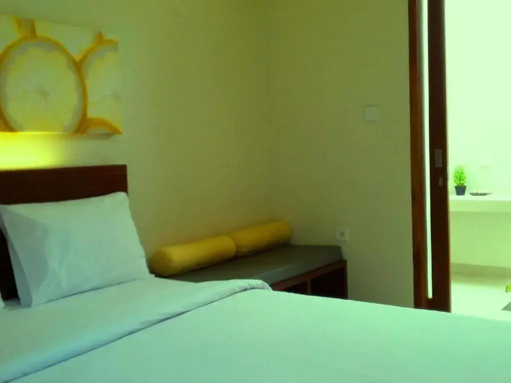 Bed in De Lemon Gatsu Hotel Bed in De Lemon Gatsu Hotel