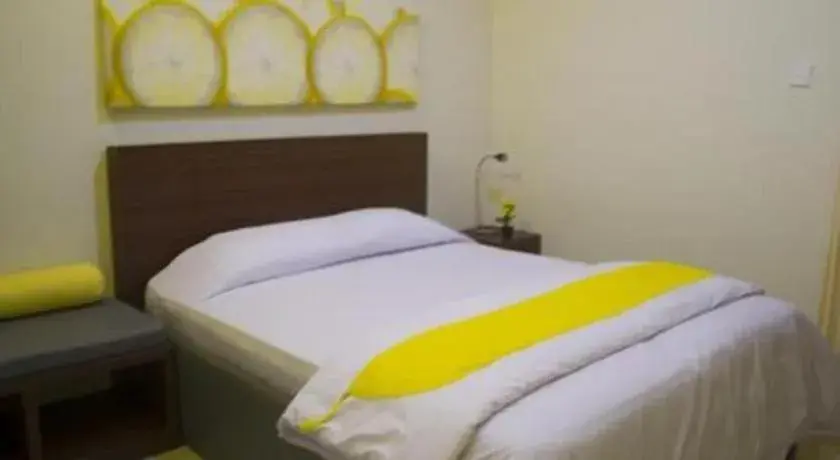 Bed in De Lemon Gatsu Hotel Bed in De Lemon Gatsu Hotel