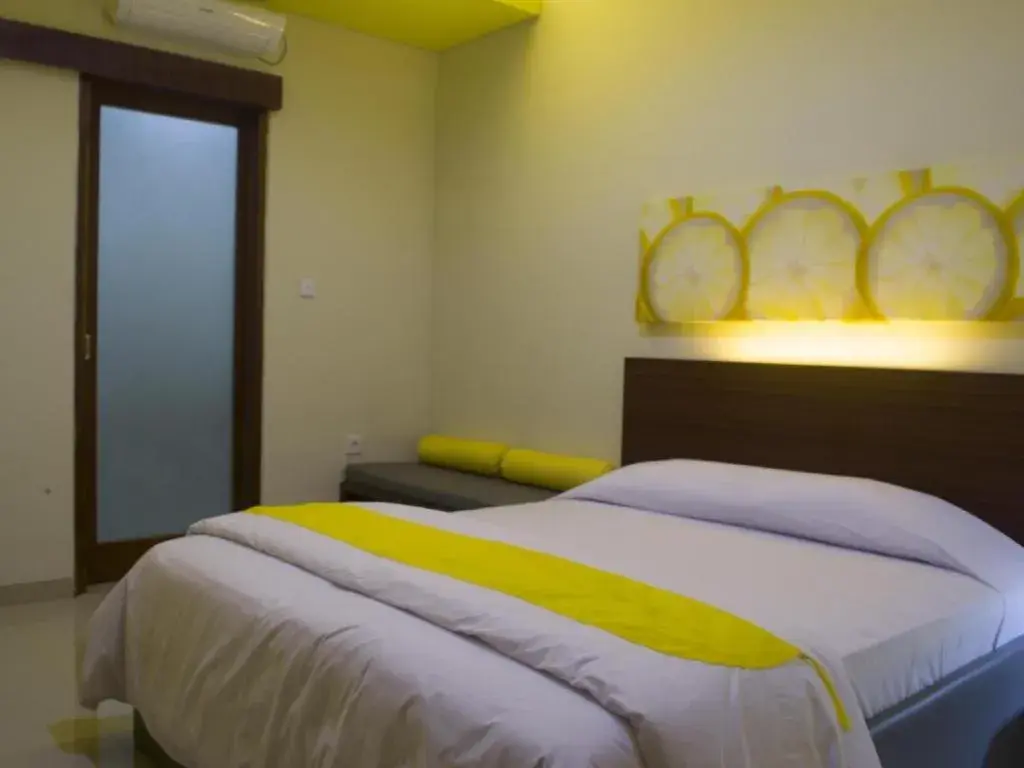 Bed in De Lemon Gatsu Hotel Bed in De Lemon Gatsu Hotel