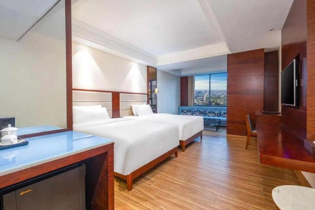 Bed in Haikou Kai Wei Hotel