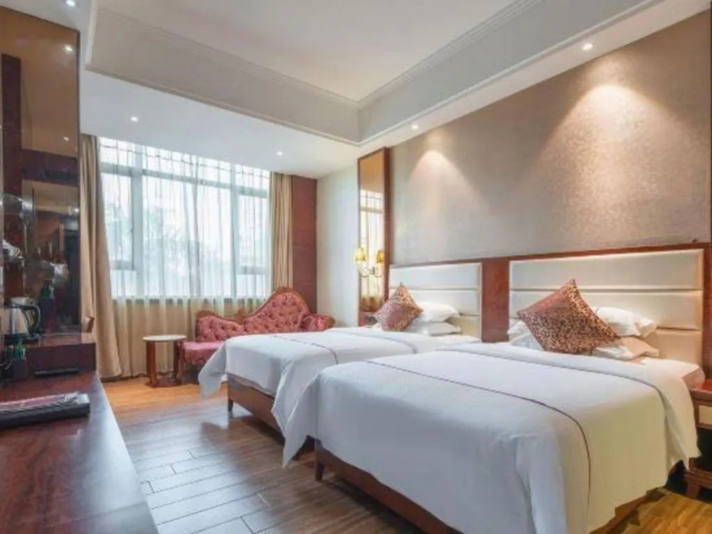 Bed in Haikou Kai Wei Hotel