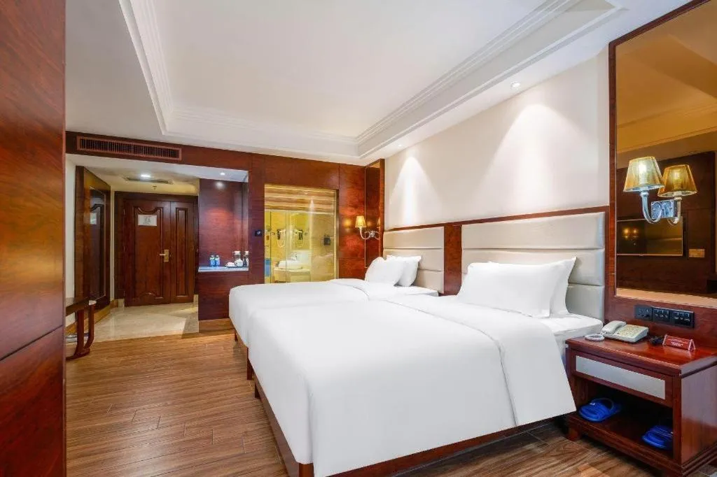 Bed in Haikou Kai Wei Hotel