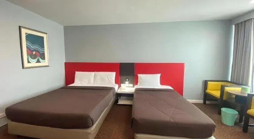 Bed in Thamrongin Hotel Bed in Thamrongin Hotel