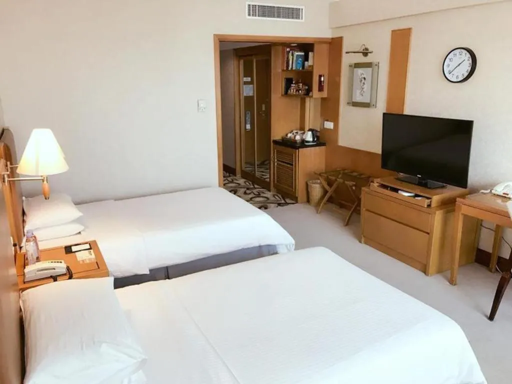 Bed in Culture Plaza Hotel