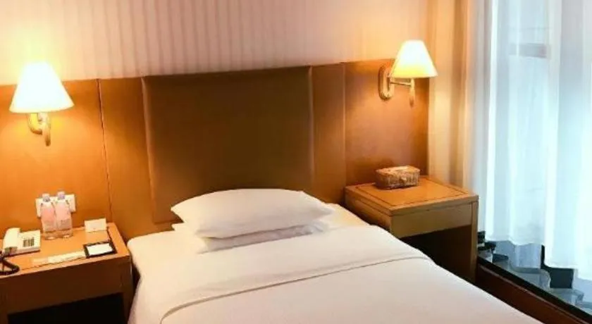 Bed in Culture Plaza Hotel