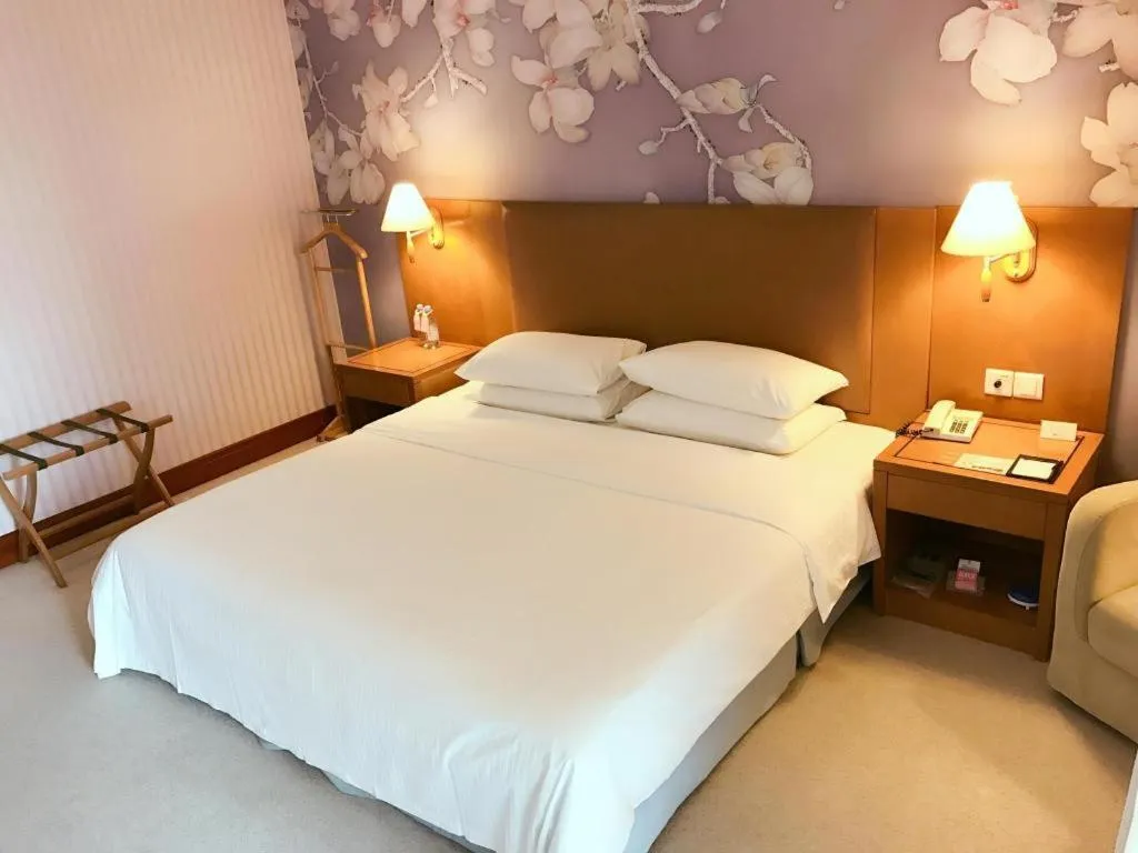 Bed in Culture Plaza Hotel