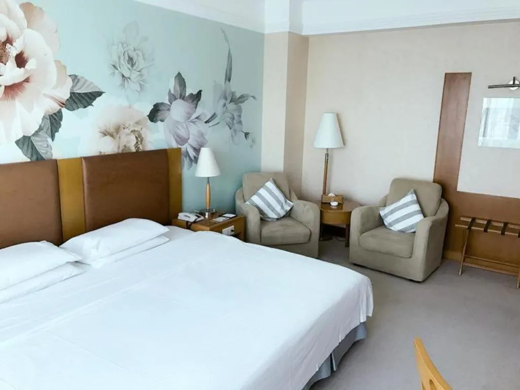 Bed in Culture Plaza Hotel