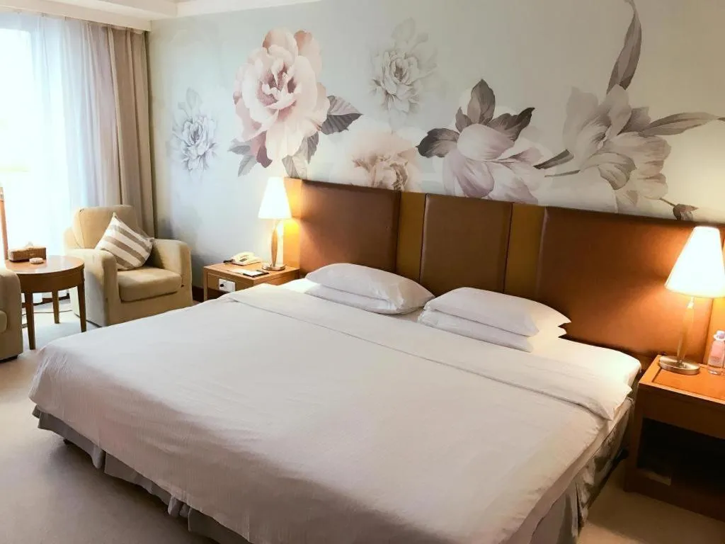 Bed in Culture Plaza Hotel