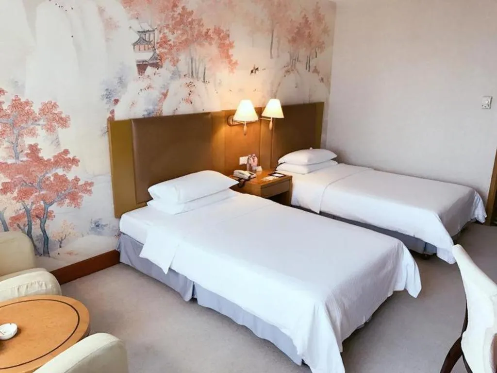 Bed in Culture Plaza Hotel