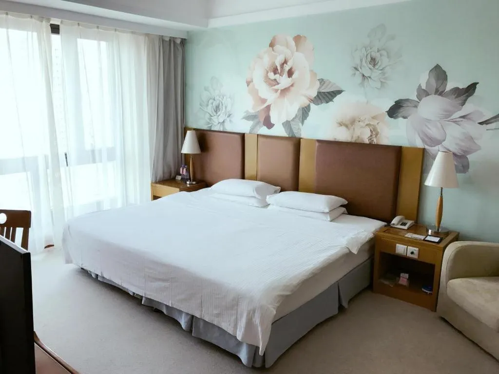 Bed in Culture Plaza Hotel