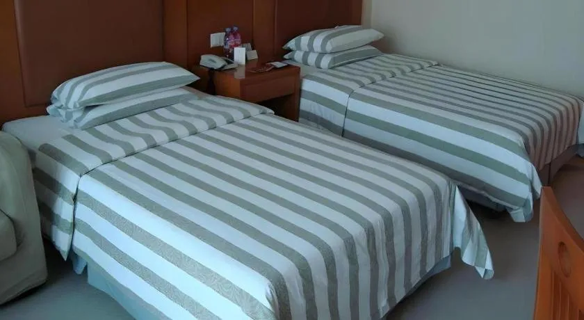 Bed in Culture Plaza Hotel