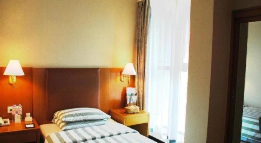 Bed in Culture Plaza Hotel