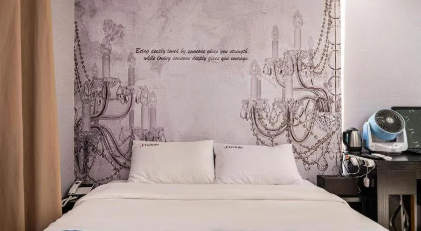 Bed in Jeju Lux Hotel