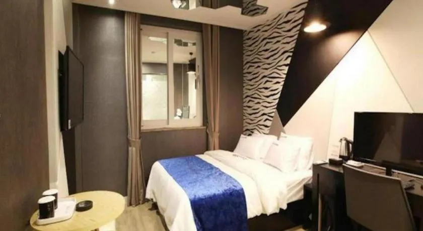 Bed in Jeju Lux Hotel