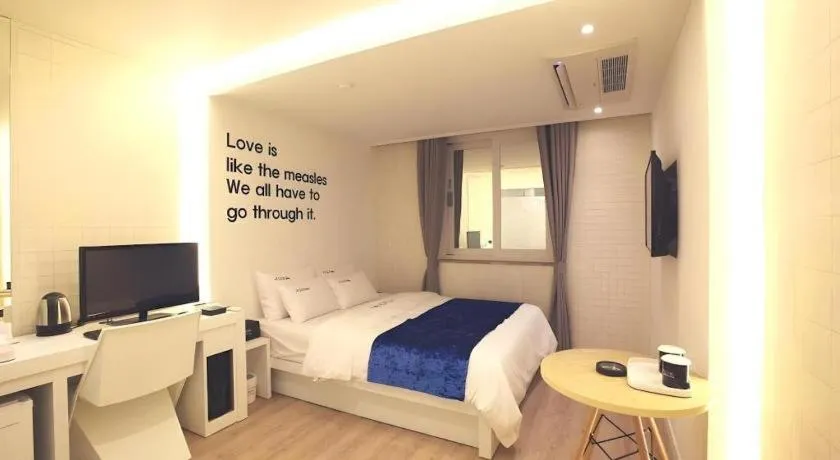 Bed in Jeju Lux Hotel