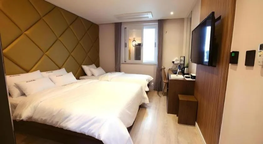 Bed in Jeju Lux Hotel