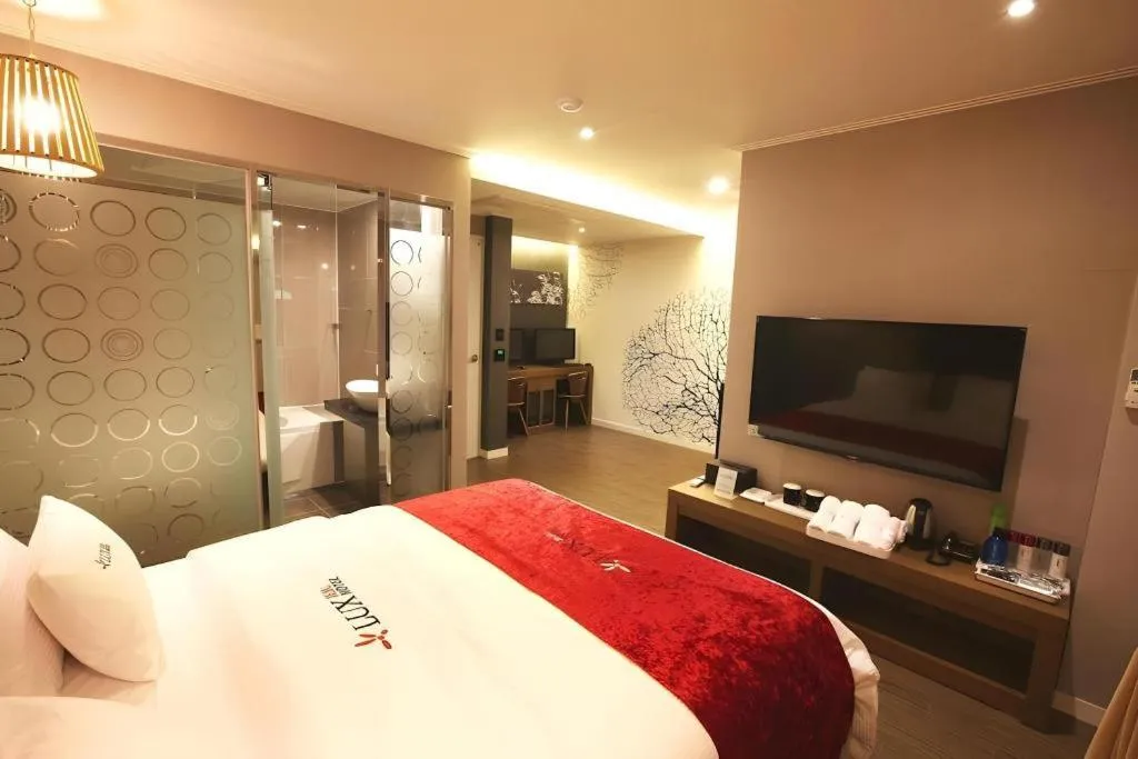 Bed in Jeju Lux Hotel