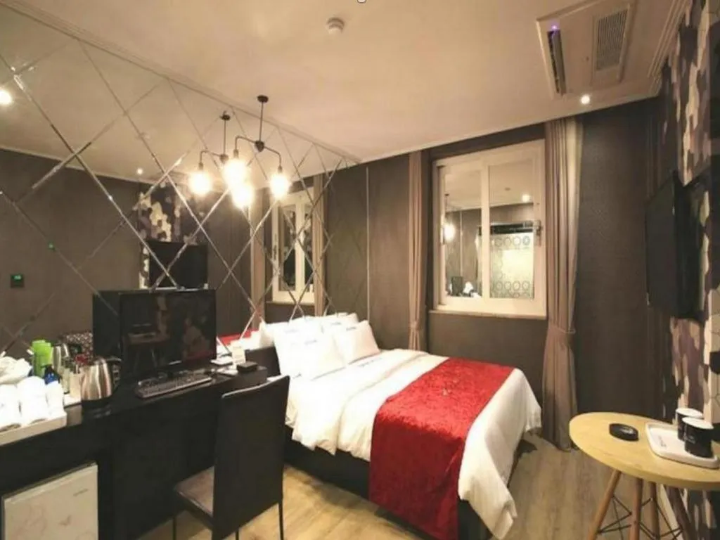 Bed in Jeju Lux Hotel