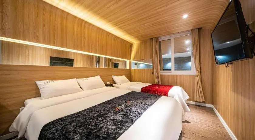 Bed in Jeju Lux Hotel