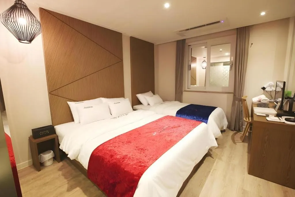 Bed in Jeju Lux Hotel