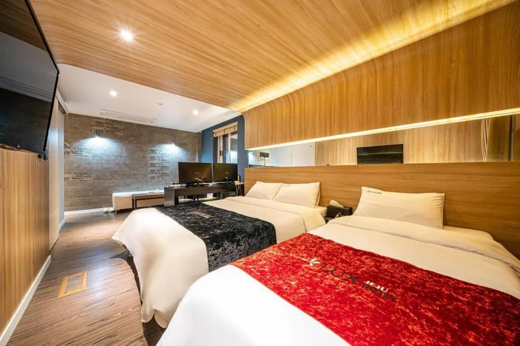 Bed in Jeju Lux Hotel