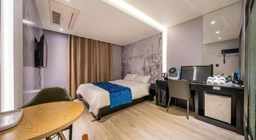 Bed in Jeju Lux Hotel