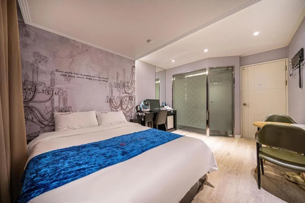 Bed in Jeju Lux Hotel