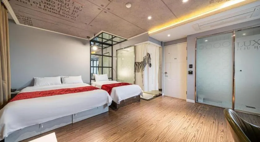 Bed in Jeju Lux Hotel