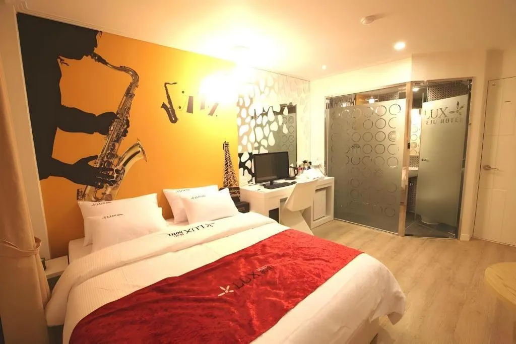 Bed in Jeju Lux Hotel