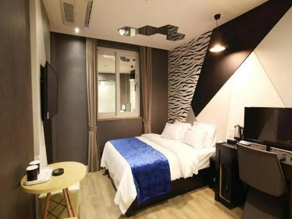 Bed in Jeju Lux Hotel