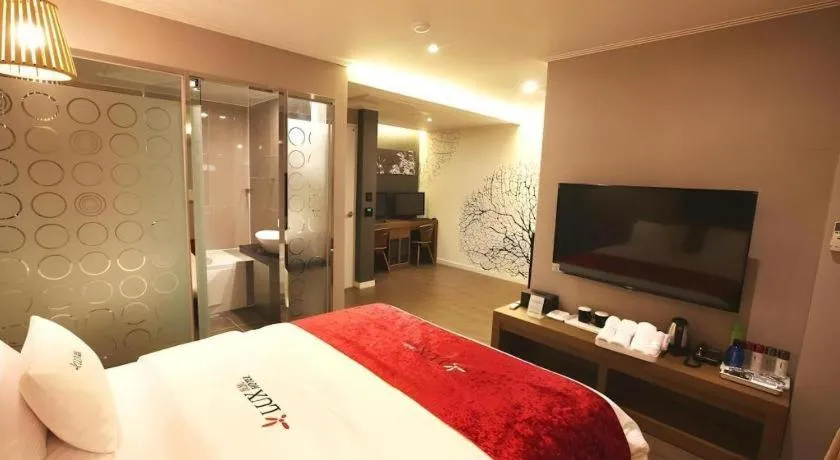 Bed in Jeju Lux Hotel